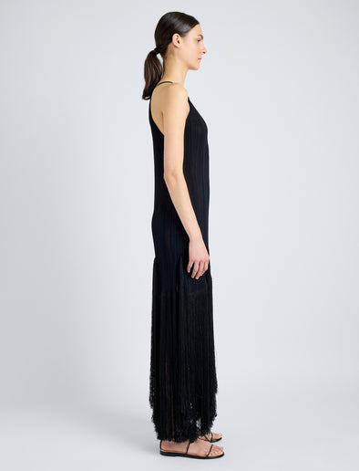 Proenza Schouler Side full length image of model wearing Everly Dress in Vicose Fringe Knit in BLACK