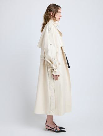 Proenza Schouler Side full length image of model wearing Sabina Coat in Lacquered Leather in Ecru