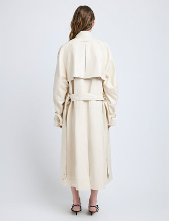 Proenza Schouler Back full length image of model wearing Sabina Coat in Lacquered Leather in Ecru