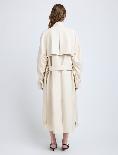 Proenza Schouler Back full length image of model wearing Sabina Coat in Lacquered Leather in Ecru