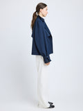 Proenza Schouler Side full length image of model wearing Larissa Jacket in Technical Nylon Jacquard in Midnight