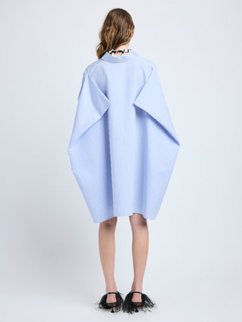 Proenza Schouler Back full length image of model wearing Isla Dress in Stripe Cotton Silk Poplin in Pale Blue Multi