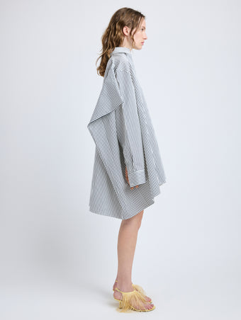 Proenza Schouler Side full length image of model wearing Isla Dress in Stripe Cotton Silk Poplin in Navy Multi