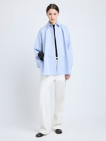 Proenza Schouler Front full length image of model wearing Hunter Top in Stripe Cotton Silk Poplin in Pale Blue Multi