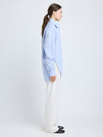 Proenza Schouler Side full length image of model wearing Hunter Top in Stripe Cotton Silk Poplin in Pale Blue Multi