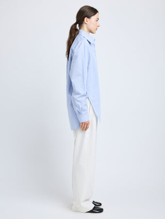 Proenza Schouler Side full length image of model wearing Hunter Top in Stripe Cotton Silk Poplin in Pale Blue Multi