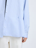 Proenza Schouler Detail image of model wearing Hunter Top in Stripe Cotton Silk Poplin in Pale Blue Multi
