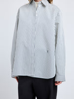 Proenza Schouler Detail image of model wearing Hunter Top in Stripe Cotton Silk Poplin in Navy Multi