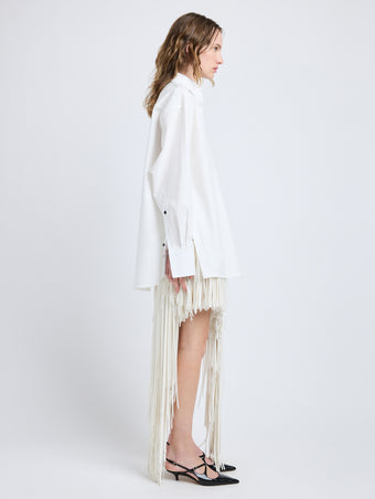 Proenza Schouler Side full length image of model wearing Addy Shirt in Compact Cotton Poplin in White