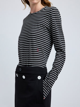 Proenza Schouler Detail image of model wearing Mia T-Shirt in Cotton Stripe Jersey in Black Multi