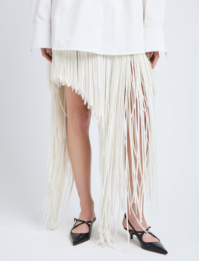 Proenza Schouler Detail image of model wearing Phia Skirt in Leather Silk Fringe in Ecru