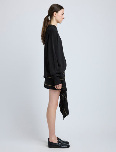 Proenza Schouler Side full length image of model wearing Rae Skirt in Stripe Bi-Stretch Viscose in Black Multi