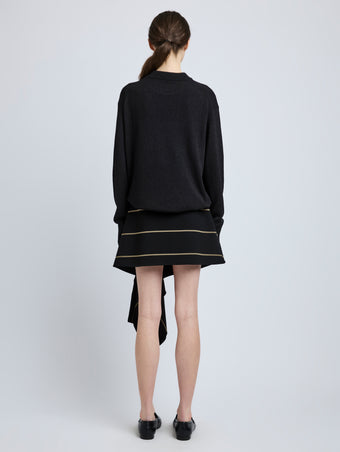 Proenza Schouler Back full length image of model wearing Rae Skirt in Stripe Bi-Stretch Viscose in Black Multi