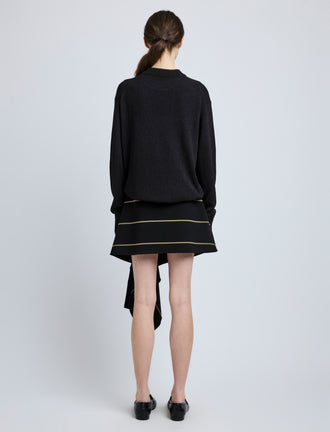 Proenza Schouler Back full length image of model wearing Rae Skirt in Stripe Bi-Stretch Viscose in Black Multi