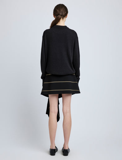 Proenza Schouler Back full length image of model wearing Rae Skirt in Stripe Bi-Stretch Viscose in Black Multi