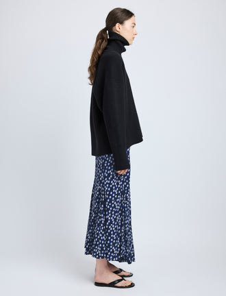 Proenza Schouler Side full length image of model wearing Joelle Skirt in Printed Silk Viscose in Navy Multi