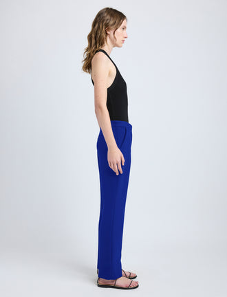 Proenza Schouler side image of model wearing Alexia Pant in Bi-Stretch Suiting in cobalt