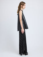 Proenza Schouler Side full length image of model wearing Effe Skirt in Compact Viscose Knit in Black