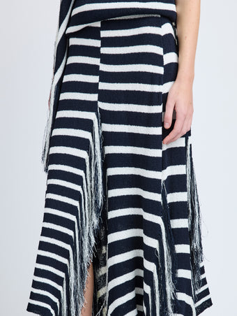 Proenza Schouler Detail image of model wearing Yves Skirt in Stripe Fringed Knit in Navy Multi