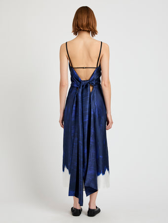 Proenza Schouler Back full length image of model wearing Wilma Dress in Double Printed Silk Twill in Cobalt Multi with back straps tied