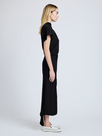 Proenza Schouler Side full length image of model wearing Hallie Dress in Hammered Viscose in Black