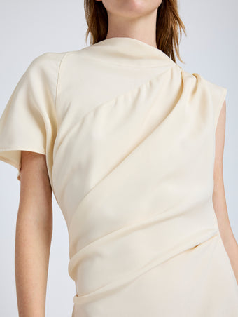 Proenza Schouler Detail image of model wearing Hallie Dress in Hammered Viscose in Champagne