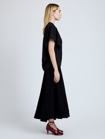 Proenza Schouler Side full length image of model wearing Etta Top in Hammered Viscose in Black