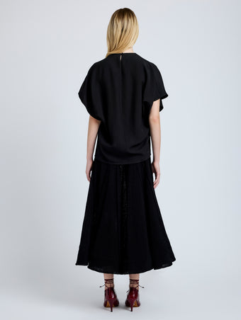 Proenza Schouler Back full length image of model wearing Etta Top in Hammered Viscose in Black