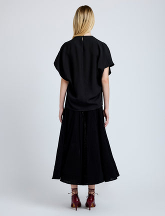 Proenza Schouler Back full length image of model wearing Etta Top in Hammered Viscose in Black