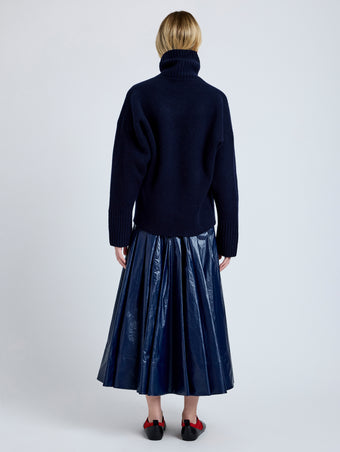 Proenza Schouler Back full length image of model wearing Petra Skirt in Lacquered Cotton in Navy