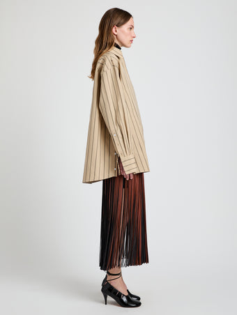 Proenza Schouler Side full length image of model wearing Veda Skirt in Faux Leather Fringe in Brown Multi