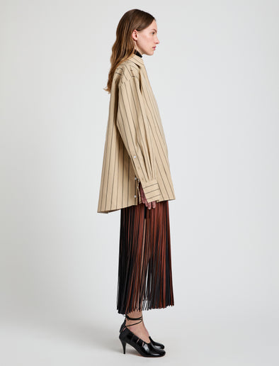 Proenza Schouler Side full length image of model wearing Veda Skirt in Faux Leather Fringe in Brown Multi