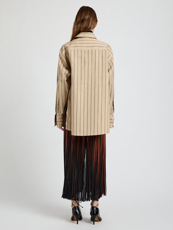 Proenza Schouler Back full length image of model wearing Veda Skirt in Faux Leather Fringe in Brown Multi