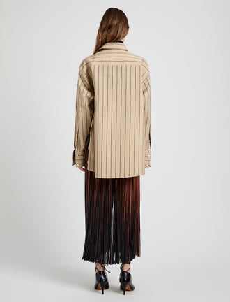 Proenza Schouler Back full length image of model wearing Veda Skirt in Faux Leather Fringe in Brown Multi