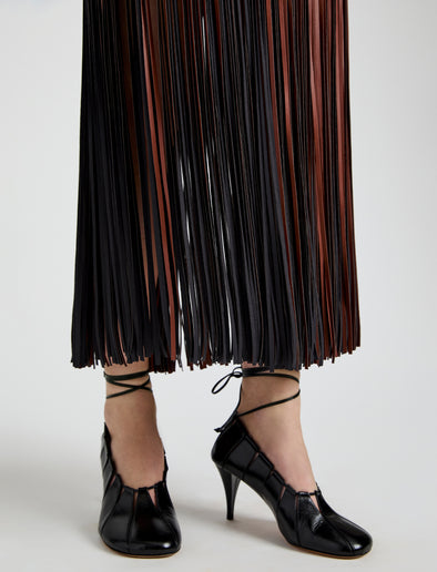 Proenza Schouler Detail image of model wearing Veda Skirt in Faux Leather Fringe in Brown Multi