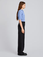 Proenza Schouler Side full length image of model wearing Reeve Polo in Cotton Knit in Pale Blue