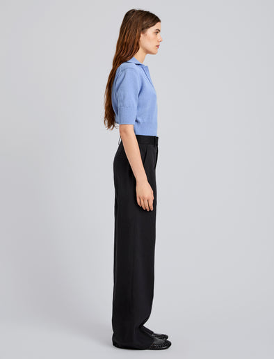 Proenza Schouler Side full length image of model wearing Reeve Polo in Cotton Knit in Pale Blue