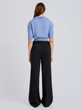 Proenza Schouler Back full length image of model wearing Reeve Polo in Cotton Knit in Pale Blue