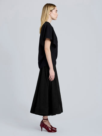 Proenza Schouler Side full length image of model wearing Tavia Skirt in Viscose Fringe Knit in Black