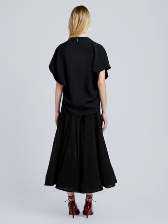 Proenza Schouler Back full length image of model wearing Tavia Skirt in Viscose Fringe Knit in Black