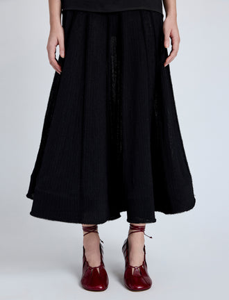 Proenza Schouler Detail full length image of model wearing Tavia Skirt in Viscose Fringe Knit in Black