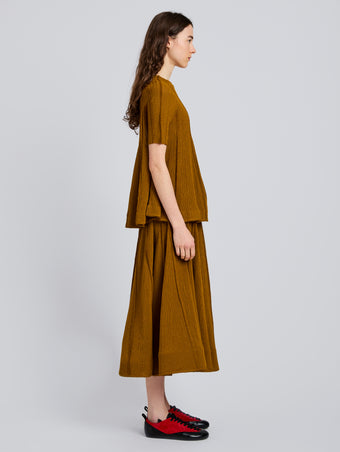 Proenza Schouler Side full length image of model wearing Tavia Skirt in Viscose Fringe Knit in Olive