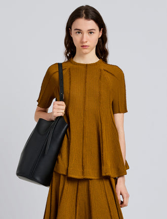 Proenza Schouler Front cropped image of model wearing Tavia Top in Viscose Fringe Knit in Olive