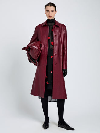Proenza Schouler Front full length image of model wearing Nissi Coat In Semigloss Leather in Burgundy