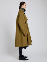 Proenza Schouler Side full length image of model wearing Adelaide Coat in Cotton Viscose Trench in Moss