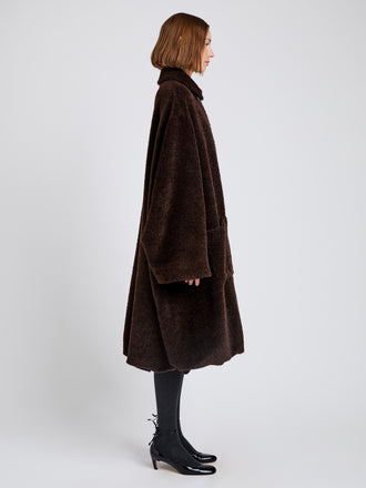 Proenza Schouler Side full length image of model wearing Verretta Coat In Alpaca Coating in Chocolate