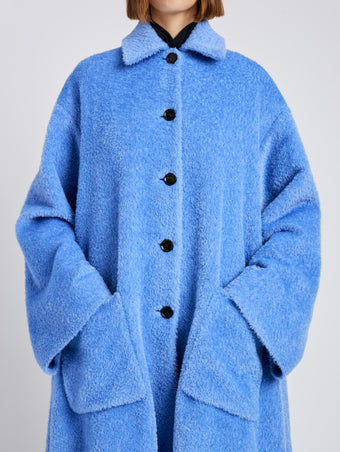 Proenza Schouler Detail image of model wearing Verretta Coat In Alpaca Coating in Sky Blue
