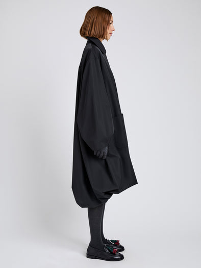 Proenza Schouler Side full length image of model wearing Verretta Coat In Coated Cotton in Black