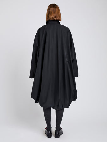 Proenza Schouler Back full length image of model wearing Verretta Coat In Coated Cotton in Black