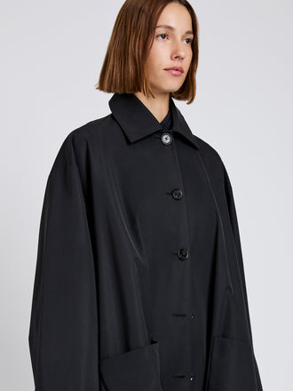 Proenza Schouler Detail image of model wearing Verretta Coat In Coated Cotton in Black